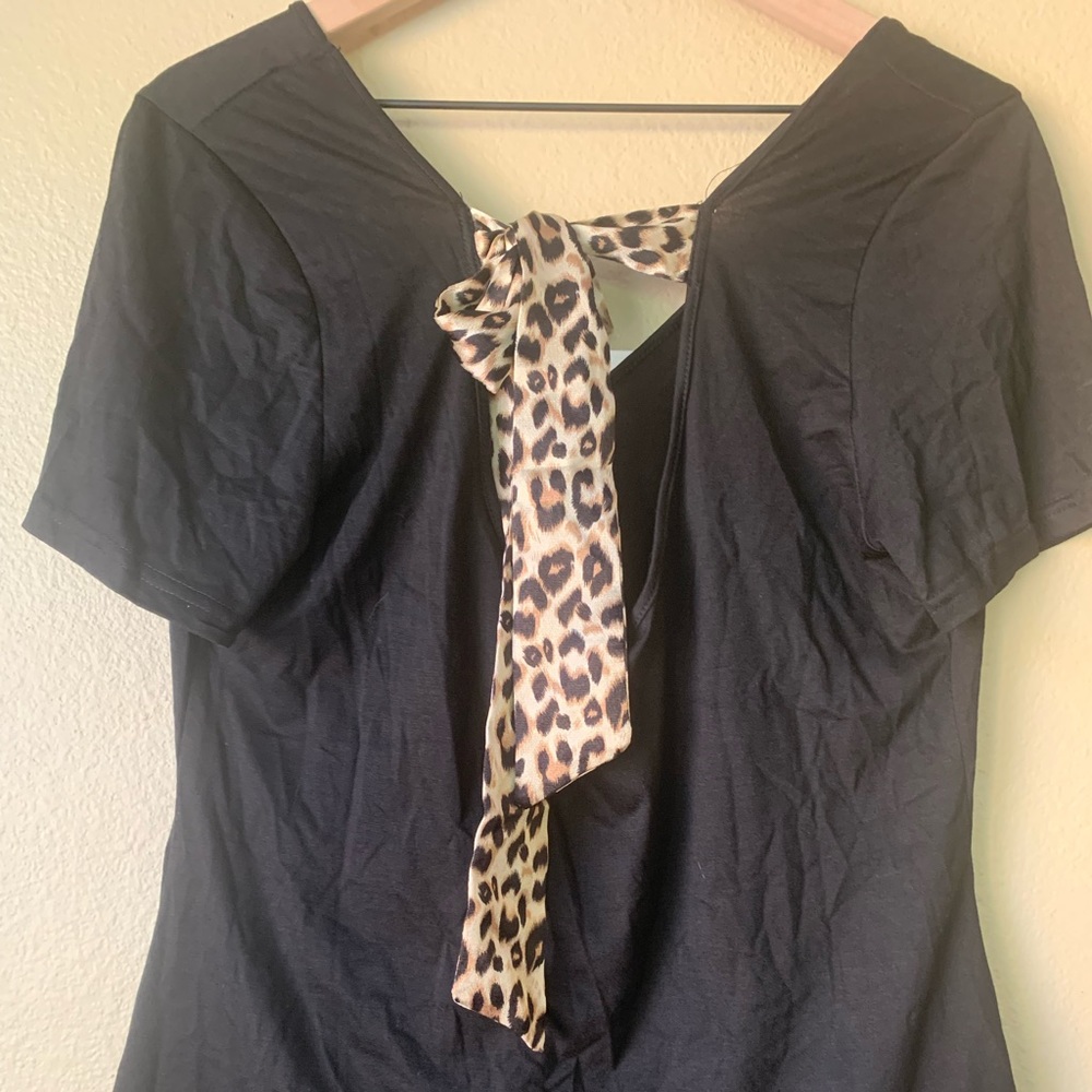 Large Shein brand cheetah print tie in the back black shirt .